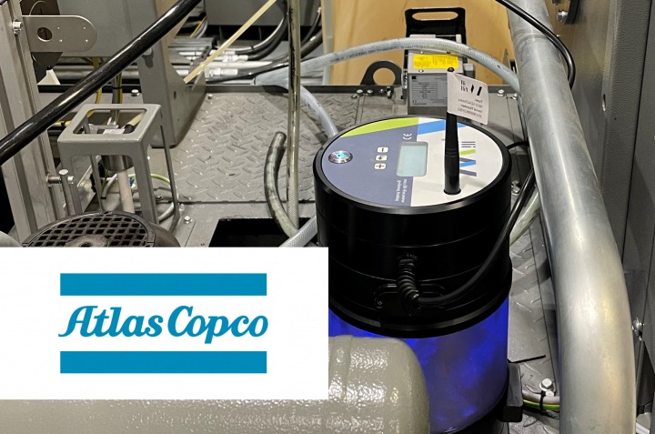 Will-Fill unit installed on an Atlas Copco machining cell, with the Atlas Copco logo